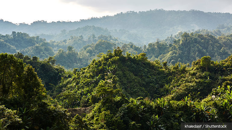 Sunshine over cloud-covered knolls in the Kaptai Lake area of Bangladesh