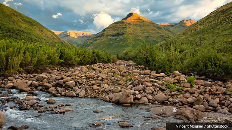 A stream runs through the Maluti Mountains at sunset in Lesotho