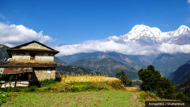 Nepalese house with mountains in the background